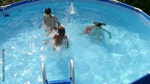 Swimming pool. Little girl jumping into the water in a pool. Slow motion. HD