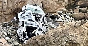 4 rescued after Tesla plunges off cliff