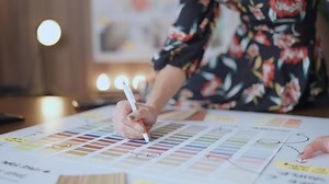 clip-1084154776-close-hand-choosing-color-sample-swatchasian-female