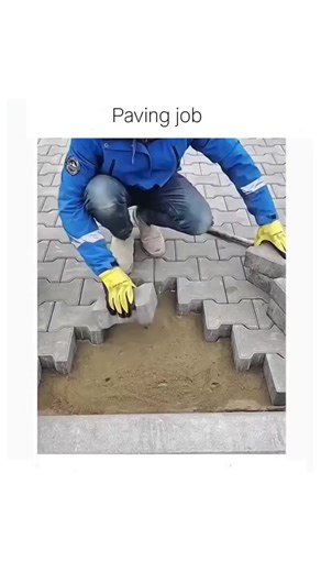 ELITE BALL🥸 on Instagram: "The post shares a 19-second video of a worker in a blue jacket meticulously placing and leveling interlocking concrete pavers into a sandy base using a mallet, captioned "Paving job," highlighting the satisfying precision of the task. Posted by @cemburuya , who curates engaging videos on tech and art, it quickly gained 2.6 million views, 2,653 likes, and 161 replies, many in Indonesian commending the "neat" and error-free installation. This content taps into ASMR-styl