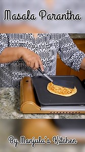 Masala Paratha Recipe | Spiced Indian Flatbread by Manjula's Kitchen Learn how to make Masala Paratha, a flavorful and spiced Indian flatbread perfect for any meal. This easy-to-follow recipe combines aromatic spices with soft whole wheat dough, creating a deliciously crispy paratha. Serve it with yogurt, pickle, or curry for a satisfying treat! Explore more vegetarian recipes on Manjula's Kitchen. | Manjula's Kitchen - Indian Vegetarian Recipes