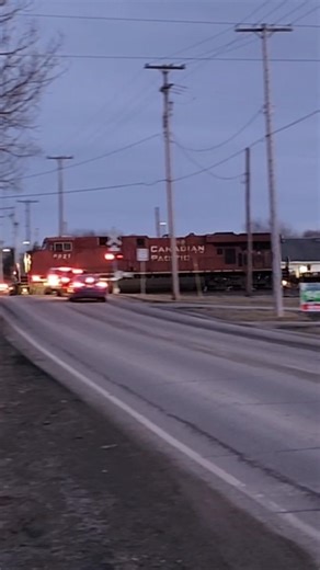 Evening run through CSX/CPKC stack train I166 rolls through a crossing! 92526 #railway #shorts