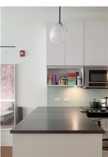 Innovative Kitchen Peninsula with Painted Plywood Countertop