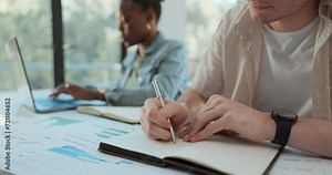 Students, writing and planning in notebook for classroom research, project ideas and brainstorming of statistics. People hands for university or college notes, graphs and charts solution and studying