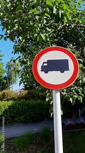 No truck road sign. Traffic sign prohibiting the movement of trucks. Freight car on white red circle. autotruck ban. Vertical