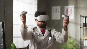 Futuristic Medical Hospital: Caucasian Male Neurosurgeon Wearing Virtual Reality Headset Uses Controllers to Remotely Operate Patient with Medical robot.