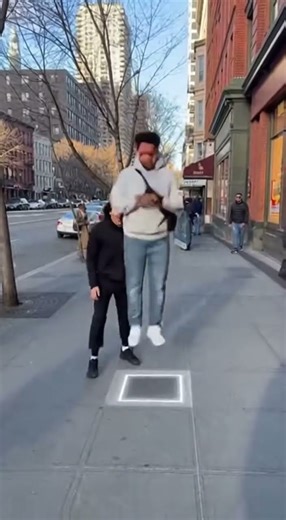 Man Rises Into the Air on Invisible Elevator in Busy City — Real Footage