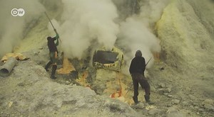 It's one of the most hazardous jobs in the world: sulfur mining in Indonesia. Miners like Sapii are exposed to toxic fumes. Gloves and masks are an unaffordable luxury. | DW Stories