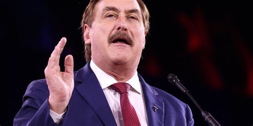 Mike Lindell pleads as he's served legal papers live on air at CPAC: 'Please, we're on TV'