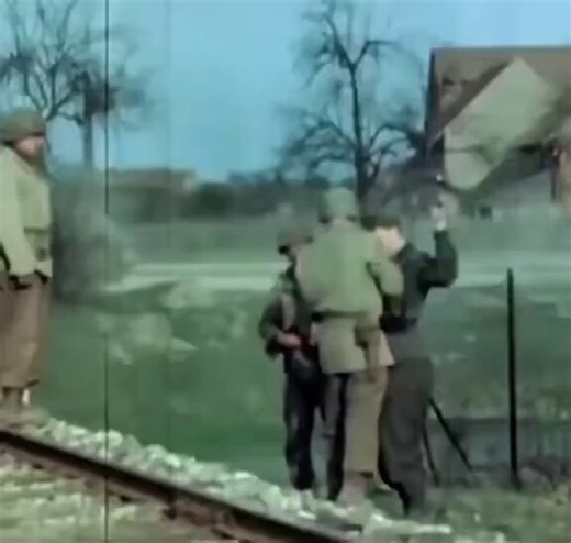 Young German surrendering to US Army in 1945. WWII footage.