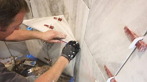 328K views · 273 reactions | Tiling Schluter-Systems North America corner shower bench using Euro trowel, ALL-SET, T-Lock, and RONDEC metal profile...1/16" plastic horseshoe shims kept profile flush with tile, which was pitched downward for proper drainage...full tutorial available in Bathroom Repair Tutor's Video Library https://bathroomrepairtutor.com/ | Home Repair Tutor | Facebook