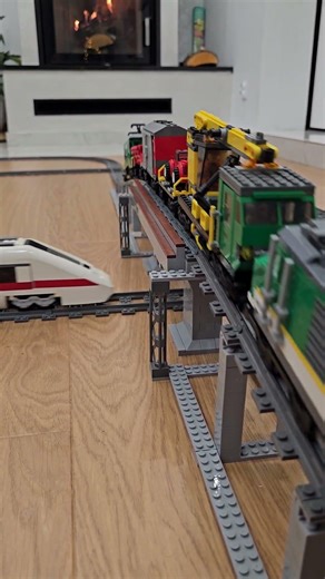 LEGO train 7898 on the extended bridge meets 7897 below - perfect timing! 🚂