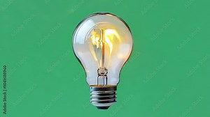 realistic glowing light bulb animation on green background, Illuminated light bulb isolated on green screen, generative ai