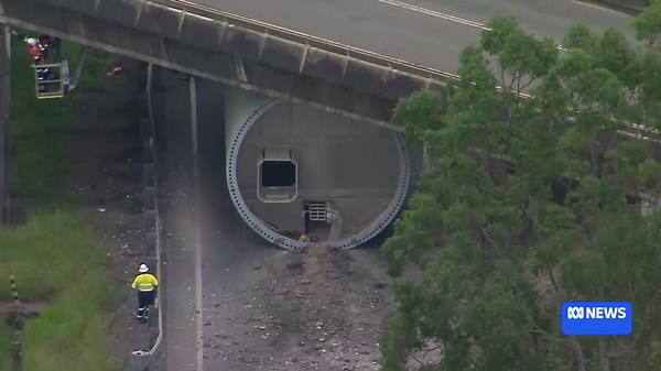 Truck carrying wind turbine gets stuck under Mount Crosby Bridge closing Warrego Highway