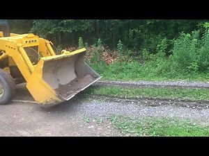how to MAINTAIN your driveway with a front end loader bucket