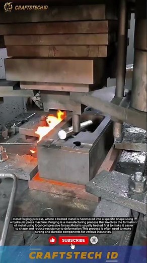 metal forging process,where a heated metal is hammered into a specific shape using a hydraulic press