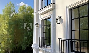 This captivating view showcases a contemporary building with stylish balconies, surrounded by vibrant trees and a peaceful landscape, creating a tranquil atmosphere