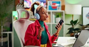 Work, laptop and dancing from phone break and music in office of graphic designer with audio. Entrepreneur, success and celebration with internet radio streaming at creative desk and streaming chair