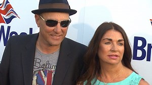 Vinnie Jones poses for press photographers with his wife in 2013