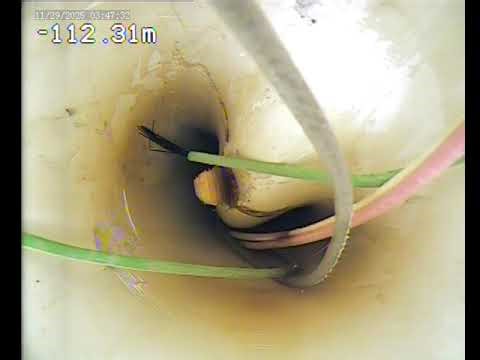 Camera down a water well to show collapsed casing. 