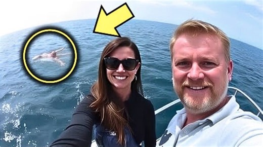 Man takes picture of his wife on their boat, then spots something unbelievable floating in the ocean