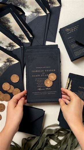 Papira • Alexandra Timita on Instagram: "Moody, gilded, and richly layered. A bold and timeless wedding invitation suite on black handmade paper with dual printing — gold foil and blind letterpress. Quietly poetic, like the setting itself! Part of our semi-custom collection."