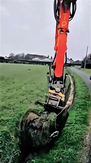Digging process of ditches with a heavy excavator with a customized bucket