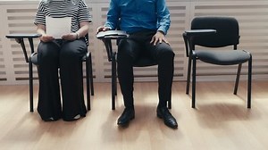 Group of people waiting for mortgage interview, live queue, recruitment process