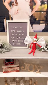 Save this elf idea for when you need it! 🎄✨ Your elf can make fairy wings with a sheet of white paper and two clear hair ties — a quick and magical setup that’s perfect for the night your child loses a tooth 🦷🧚‍♀️ The message board says, “I met the tooth fairy and she taught me how to make fairy wings.” You can even leave the tooth fairy money right next to your elf instead of hiding it under the pillow! 💸 Our Elf on the Shelf fun gets over 20 million views each year, and I’ll be sharing ton