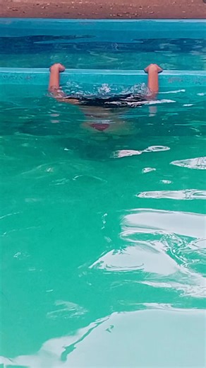 Swimming Pool Fun with Long Hair and Red Swimsuit