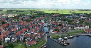 Makkum village in the Dutch province of Friesland located between the Afsluitdijk and Workum on the coast of the IJsselmeer. The Netherlands. Aerial view.