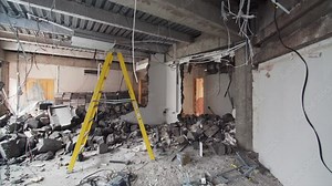 Camera is moving forward, view of demolition work in apartment. The room is full of broken bricks and blocks from broken walls Stock Video