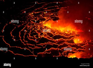 NYIRAGONGO, DR CONGO: STRIKING pictures and video from one of the world’s most destructive volcanos shows lava brimming as increased activity has led scientists to believe Africa will be shortly rocked by a potentially disastrous eruption. The pictures capture the bright red lava bubbling against the stark contrast of the dark ground in the pitch black of night at the Nyiragongo Volcano in the Democratic Republic of Congo – which travelled up to 37 miles-per-hour in a deadly magma stream which k