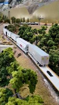 Twin DD40AXs take a manifest freight through Applegate on our HO Scale layout