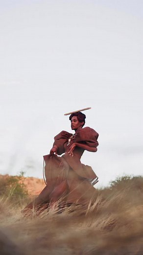This costume is a homage to the evolution of a people and culture that was and is today, projecting into the future. Celebrating and combining Namibia’s OvaHerero and OvaHimba cultural heritage, a costume that embodies strength, resilience, grace and metamorphosis. The skirt, bold arms and headpiece drawing inspiration from OvaHerero modern day cultural dress, a symbol of adaptation and endurance. While the belt and accessories from the OvaHimba, symbolise resistance and ancestral wisdom. Crafte