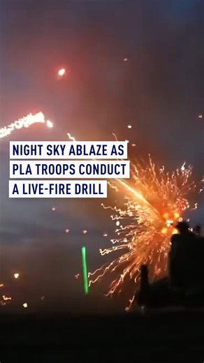 Night sky ablaze as PLA troops conduct a live-fire drill