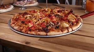 This pizza is topped with an entire Pupu Platter. With chicken, beef, egg rolls, and more - it's an insane experience. | Phantom Gourmet