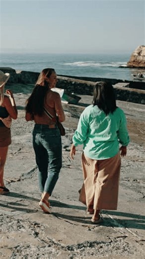 clip-4036811715-women-friends-pointing-ocean-view-sightseeing-adventure