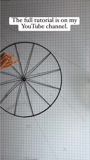 This is a tutorial to guide you through the process of transforming a Dollar Tree bicycle wheel frame into a stunning base for a wreath. To begin, gather a bicycle wheel frame from Dollar Tree, some pipe cleaners, and your favorite deco mesh. Let's get started! With just a few simple steps, you can create a beautiful wreath that will impress all who see it. Follow along as I show you how to take this inexpensive wreath frame and turn it into a piece of decor that you can be proud to display. Wit