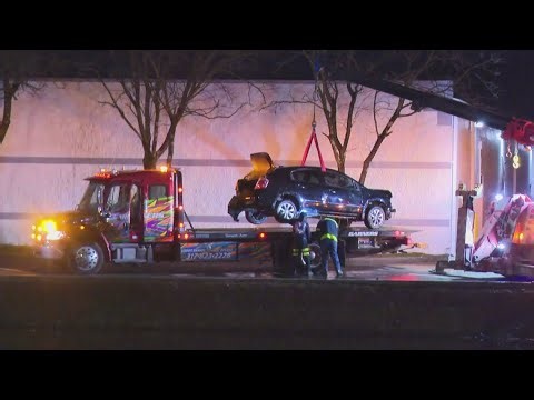 Father dies, 2 children rescued by police officers after car crashes into northeast Indy retention p