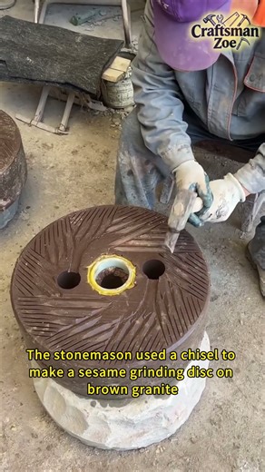 The stonemason used a chisel to make a sesame grinding disc on brown granite