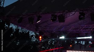 The result of work of lighting engineer at a concert. Soffits, ramp, blinder, parabolic aluminum reflectors. Multi-colored highlights and rays shine alternately. Lighting design for the concert stage