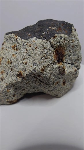 This is a nice fresh big ordinary chondrite 351 grams possible L5 or L6 found in Algeria , possible year is 2021, this piece has in some place black fusion crust with some rusting , also the meteorite is cracked maybe it is possible from the fall to the ground, chondrules are visible with some rusting spots. #meteorite #Chondrite #algeria | Nicholas Aristeidou