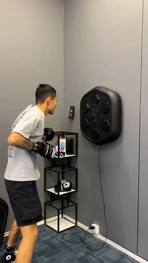 Introducing the Music Boxing Training Machine! Unleash your inner fighter with this revolutionary device designed to pack a punch in your workout routine. Step into the ring and feel the adrenaline surge as you jab, hook, and uppercut to the beat of your favorite tunes. With its cutting-edge technology and sleek design, this powerhouse will transform your fitness journey into an electrifying experience. | Music Boxing Machine