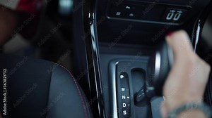 woman driving car moving transmission shift gear.automatic car gear