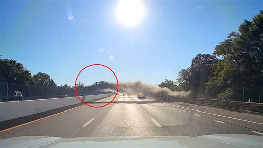 Insane moment a car flies over a busy highway in Long Island