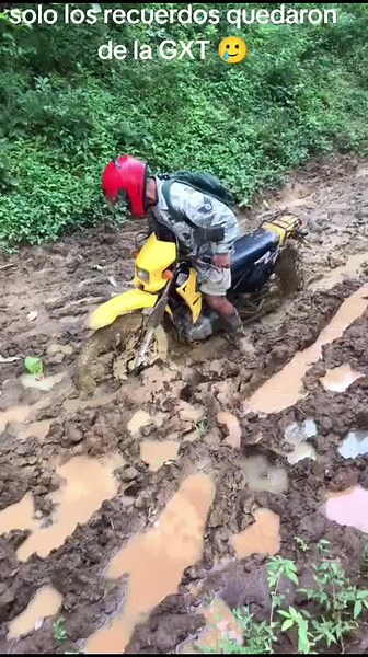 Struggling to Ride Through Mud on a Motorcycle