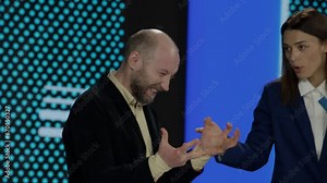 Guest guessing the right answer during recording of a fictional morning family game show Stock Video