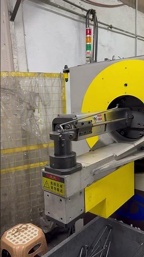 Watch a CNC machine bend steel wire into shape