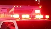 Ambulance lights flashing at night downtown